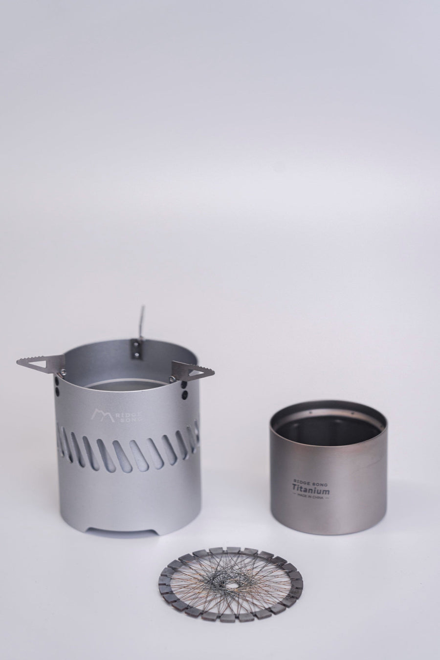 The Blaze stove body, inner burner and circular mesh shown separately on a light background.