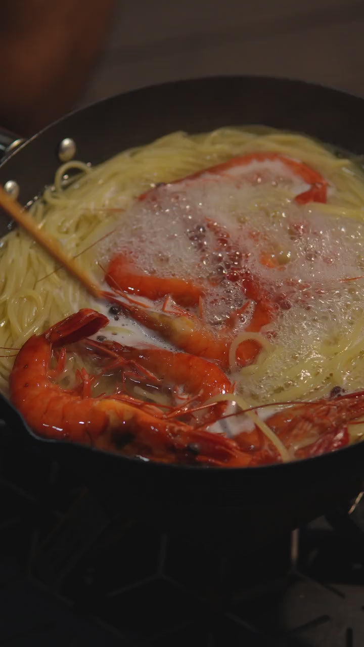 Load video: Shrimp and noodles simmering in the YS012 pan; no audio