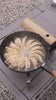 Dumplings cooking in the YS012 pan at camp; no audio
