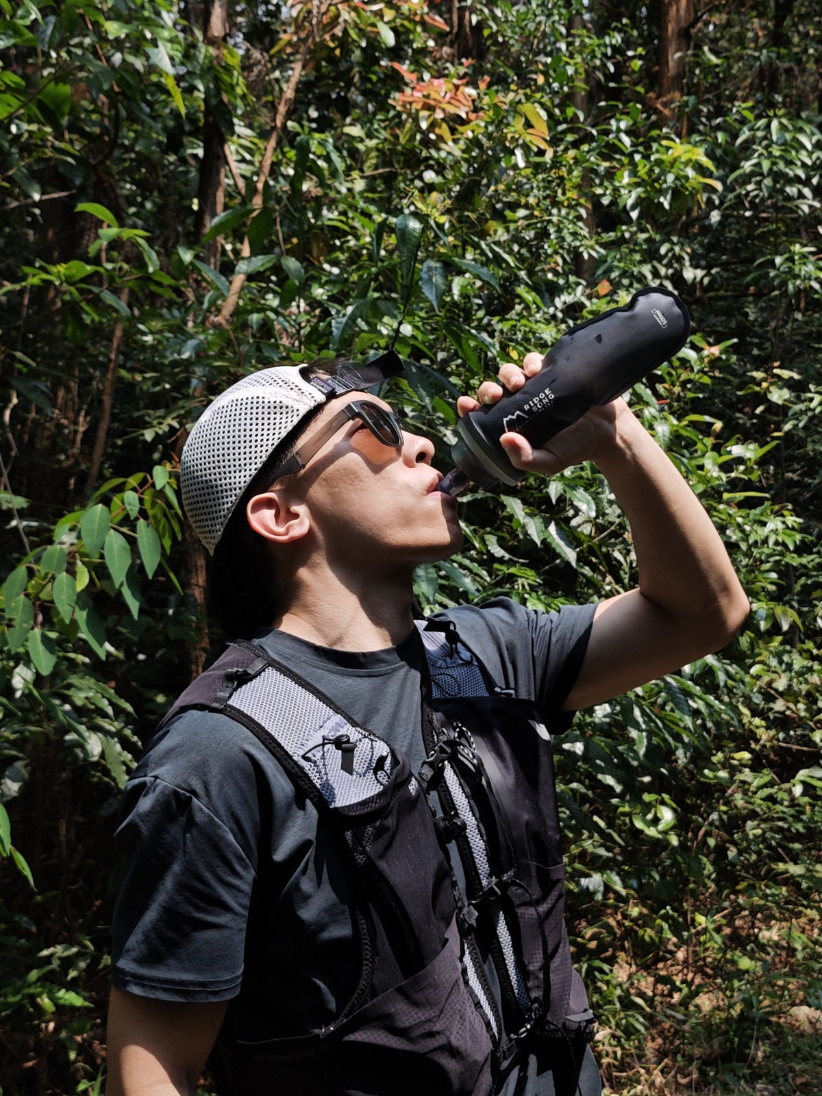 Runner drinking from a RidgeSong soft flask