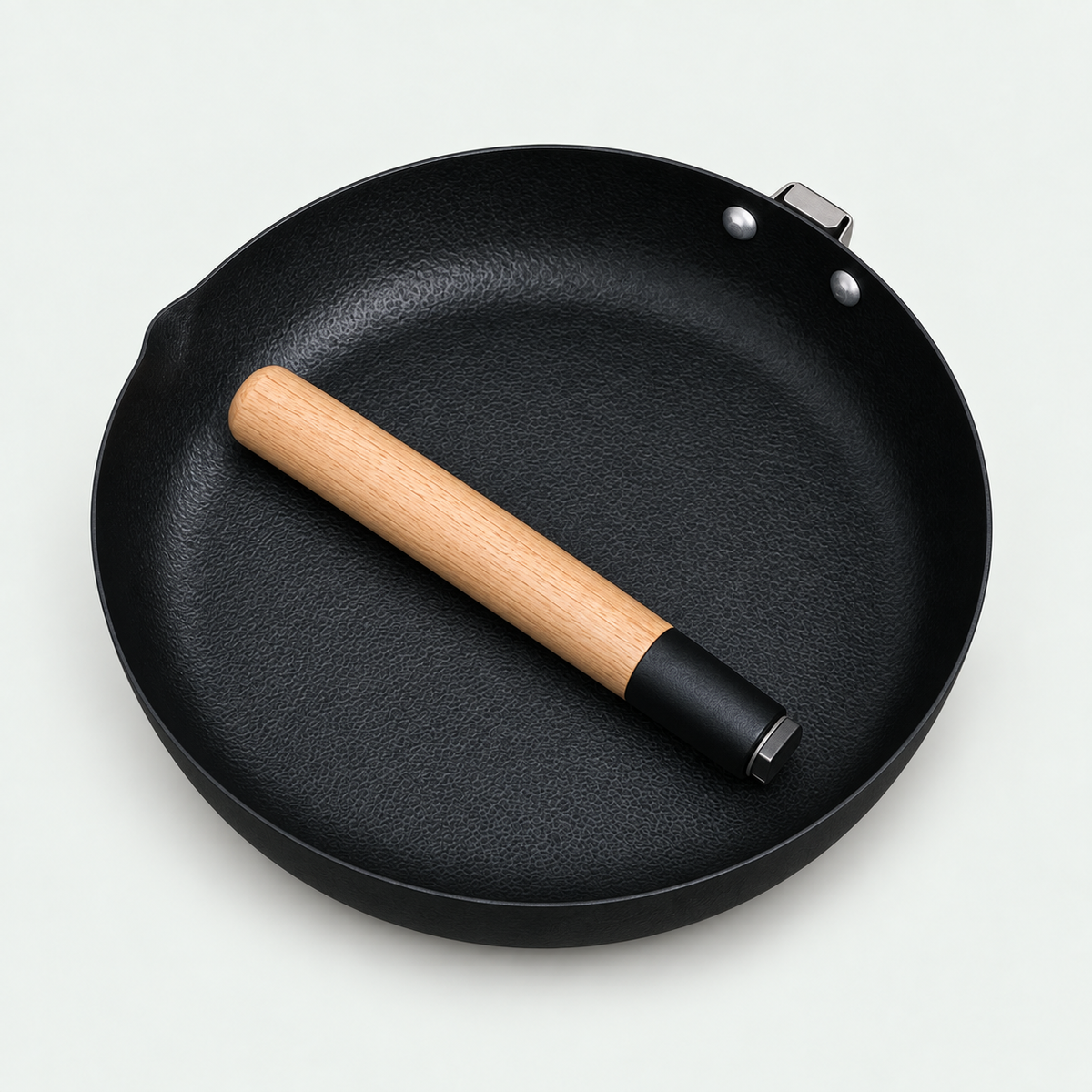 Product visualization: detached white oak handle stored inside the YS012 iron pan