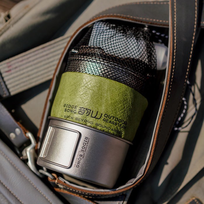 The packed cookware system carried inside a backpack